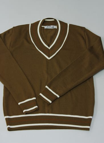 Green brown tobacco shade with white and tan contrast looping; V neck, styled after the turn of the century sports jumpers; trim fit, a very soft 12 gauge extra fine merino wool by Tollegno of Biella, Italy. This is made in 40 pieces total locally here in Spain.